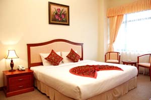 Deluxe double with city view, balcony, private facilities (bath and shower), and breakfast
